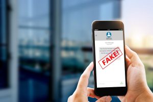 Fake,Text,Message,Sms,Scam,Or,Phishing,Concept.,Man,Hands