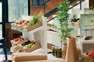 Eco friendly zero waste supermarket selling nonpolluting local organic produce, advertising healthy lifestyle. Empty grocery store having locally grown sustainable fruits, vegetables and herbs.
