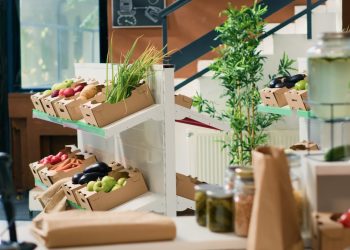 Eco friendly zero waste supermarket selling nonpolluting local organic produce, advertising healthy lifestyle. Empty grocery store having locally grown sustainable fruits, vegetables and herbs.