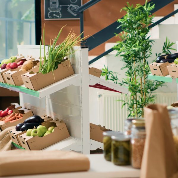Eco friendly zero waste supermarket selling nonpolluting local organic produce, advertising healthy lifestyle. Empty grocery store having locally grown sustainable fruits, vegetables and herbs.