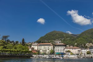 Unidentified people at town Cernobbio on Como Lake in Italy. It is a popular holiday resort