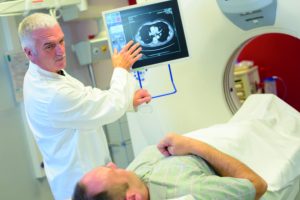 Man having scan, doctor discussing results